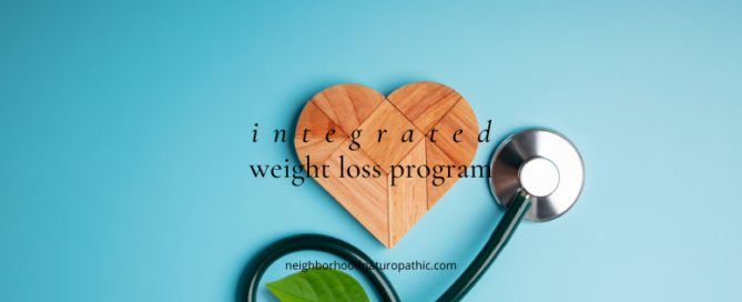 stethoscope and heart representing a naturopathic approach to weight loss and weight management with the overlay of words reading: Integrated Weight Loss Program at Negihborhood Naturopathic in St Paul Minnesota